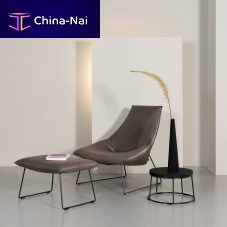 Contemporary fireside chair Bealleathersteelwith footrest
