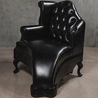 Classic armchair THE MELTINGleatherwith footrestwing