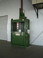 Vertical baling press front-loadingfor wastedownstroke