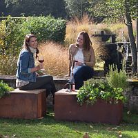 Contemporary garden bench HG-BteakCOR-TEN® steelwithout backrest