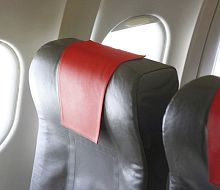 Aircraft cabin headrest cover