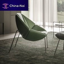 Original design armchair MANTRA fabricleatherwith footrest