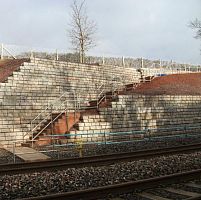 Concrete retaining wall REDI-ROCKmodularprefabfor bridge construction