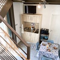 Compact kitchenette woodenwith swing doors