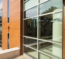 Stick system curtain wall SMARTIA M7aluminum and glasstransparent