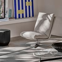 Contemporary fireside chair Kudofabricleatherwith footrest