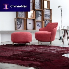 Contemporary armchair JAMMINGleatherfabricwith footrest