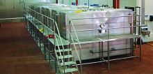 Immersion cooking unit for sausages