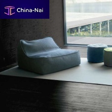 Contemporary fireside chair FLOATfabricupholsteredwith washable removable cover