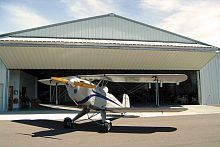 Folding hangar door automatic