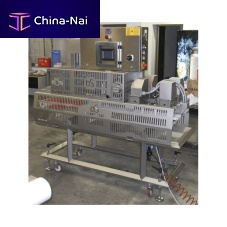 Foodstuff cutting machine TBSVPLC-controlledwith conveyor