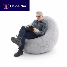 Contemporary bean bag STONE CAPSULESwoolhandmadewith footrest