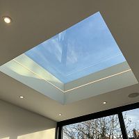 Flat roof skylight smoke controlfor ventilationwith skylight frame