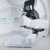 Proton therapy synchrocyclotron with robotized positioning table Proteus® ONEwith integrated CT scanner