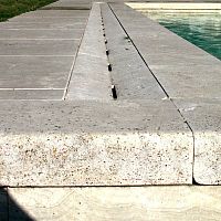 Drainage channel with central slot double-slopepavedtravertine