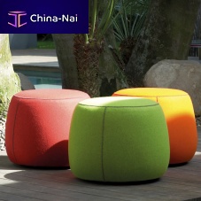 Contemporary ottoman Apelfabricleatherround