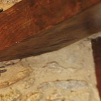 Solid wood beam with symmetrical section