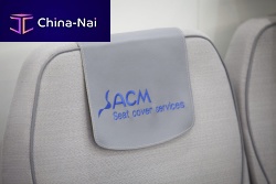 Aircraft cabin headrest cover