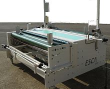 Fabric inspection machine with reconditioning