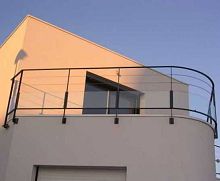 Glass panel balcony with barssteel