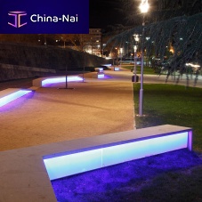 Contemporary public bench CAMALEONstonewith integrated LED lighting