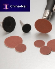 Synthetic fiber abrasive disc for polishingpressure-sensitive adhesive (PSA)