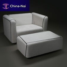 Contemporary armchair leatherfabricwith footrest
