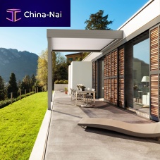 Self-supporting pergola PINDEwall-mountedthermo-lacquered aluminumwith mobile slats
