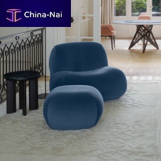 Contemporary fireside chair PUKKAfabricwith footrestwith removable cover